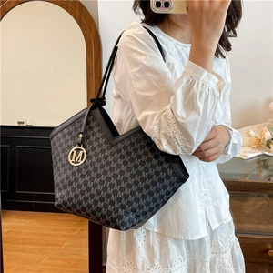 Vintage large capacity black tote bag with all-over M monogram and gold charm