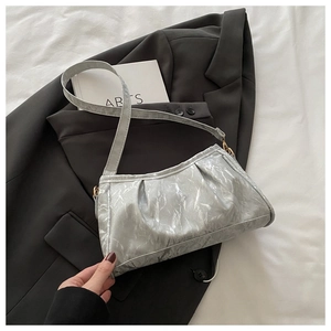 Detailed close-up of light gray marble textured underarm bag with refined pleated design