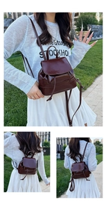 Detail view of burgundy glossy faux leather mini backpack with drawstring closure