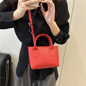 Minimalist red lychee grain leather mini crossbody bag for women in a 45-degree side view