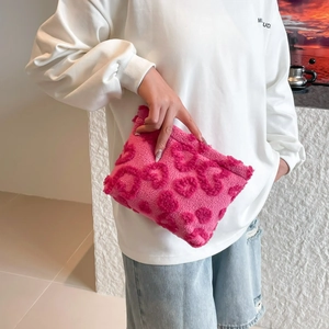 Pink plush clutch bag with 3D heart pattern for women, minimalist summer fashion style