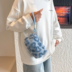 Blue leopard print plush makeup bag with soft faux fur and convenient wrist strap