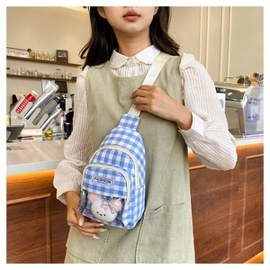 Blue checkered crossbody bag with transparent pocket and cute plush bear detail