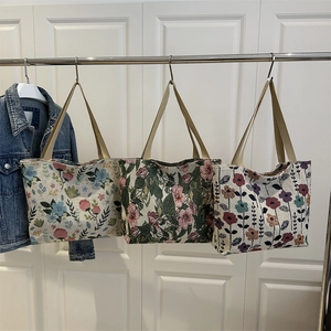 Three floral canvas tote bags with jacquard texture and khaki woven handles for daily commute