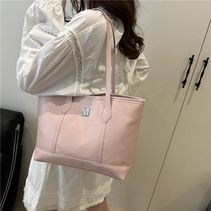 Pink large capacity PU leather tote bag with embossed emoji patterns for daily commuting