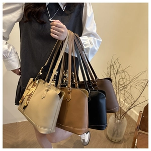 Detail of minimalist PU tote bags in multiple colors with stylish contrast stitching