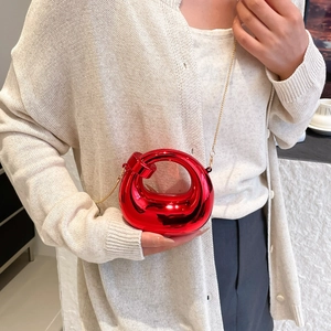 Red mirror-finish mini crescent bag with circular handle and gold chain strap