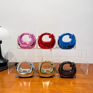 Metallic crescent crossbody bag with acrylic chain strap shown in six vibrant colors