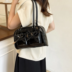 Glossy black underarm bag with multi-pockets and bow details for women
