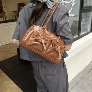 Deep brown ballet-style PU leather shoulder bag with decorative bows and front pockets