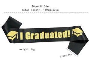 Detail of black satin graduation sash with golden I Graduated text and dimensions