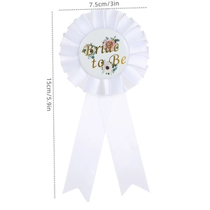 Detailed view of white Bride to Be rosette badge with 7.5cm diameter and floral design