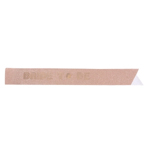 Detail of rose gold glitter sash with Bride to be text for bridal shower party decoration