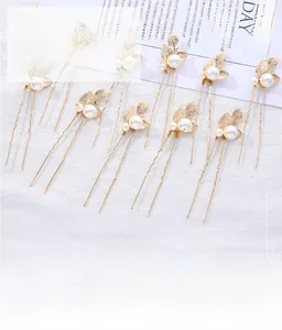 Detailed view of Baroque pearl leaf hair pins in gold finish for bridal wedding styling