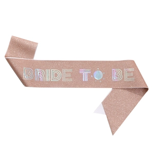Detail of rose gold glitter Bride to Be sash with silver laser lettering for parties