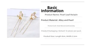 Detailed close-up of golden leaf hair pin with pearls on a white textured background