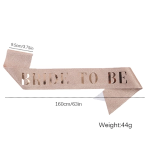 Close-up of rose gold glitter sash with Bride To Be lettering and dimensions info
