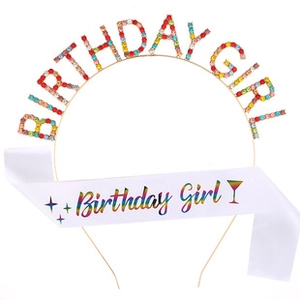 Detail view of gold birthday girl rhinestone headband and white satin sash set