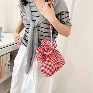 Minimalist red and white plaid drawstring bucket bag with floral petal closure for women