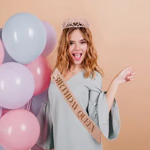 Sparkling Birthday Queen sash and tiara set shown on a model in a festive party setting