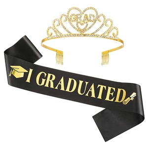 Detailed set of gold rhinestone graduation tiara and black satin sash with gold lettering