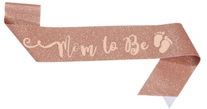 Close-up of glitter rose gold Mom to Be sash with baby footprints for gender reveal parties