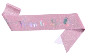 Detailed close-up of pink glitter sash with Mom to Be holographic lettering and baby footprints
