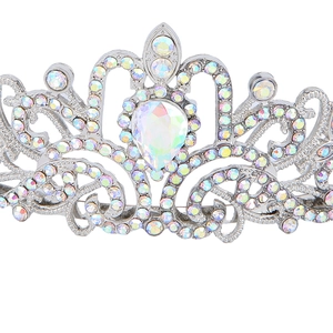 Macro shot of a silver crystal tiara with pear-shaped rhinestones and intricate scrollwork