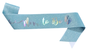 Close-up of baby blue glitter sash with holographic Mom to Be text and footprints