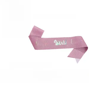Detailed views of pink glitter birthday sash with laser It's my Birthday lettering