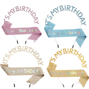 Detail view of the birthday party set featuring glitter sashes and crown tiaras in four colors