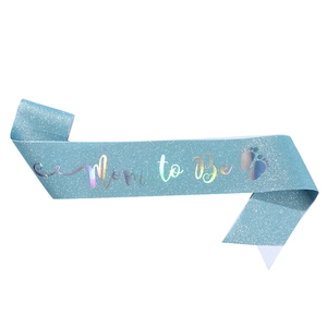 Light blue glitter Mom to Be sash with holographic font and baby footprints for baby showers