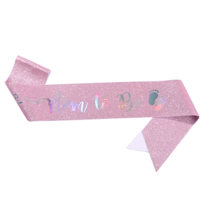 Pink glitter Mom to Be sash with silver laser lettering and baby footprints for baby shower