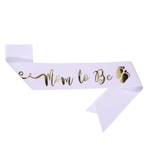 Glittery Mom to Be sash with gold foil lettering and baby footprints for baby showers