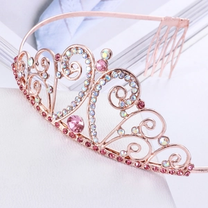 Detail of rose gold birthday tiara featuring pink gemstones and AB rhinestones setting