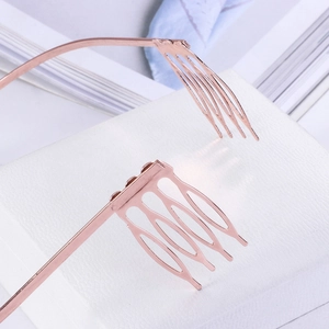 Detailed close-up of rose gold crown headband showing non-slip comb teeth structure