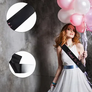 Detail of Sweet 16 black satin sash featuring pink glitter font and premium printing