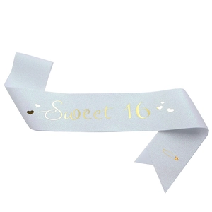 Pearlescent white Sweet 16 sash with gold lettering and heart patterns for birthday party