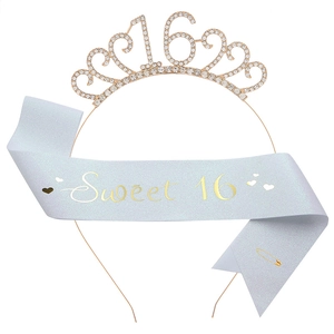 Detail of glittery light blue Sweet 16 sash with gold lettering and rhinestone crown