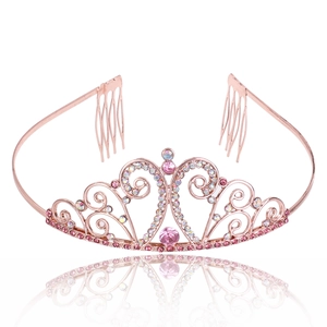 Rose gold fashion crown with pink crystals and side combs on a white background