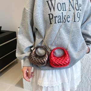 Quilted mini bags in red and bronze with round handles and gold chain straps