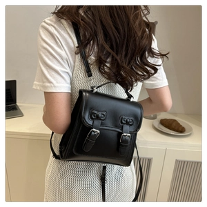 Rear view of black lace bow backpack on model in a modern minimalist lifestyle setting