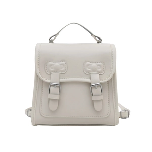 Creamy collegiate faux leather backpack with bow stitching and dual buckle straps