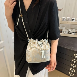 Light blue embroidery bucket bag with pearl handle and metal chain for women