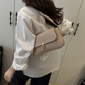 French style beige leather underarm bag with gold oval clasp buckle for women