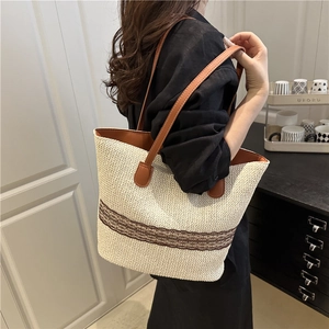 Large woven tote bag for women with chic brown cutout pattern and leather shoulder strap