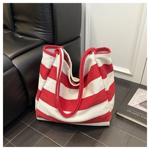 Close-up of red and white striped canvas tote bag with large capacity for daily shopping