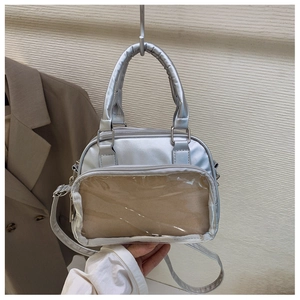 Detailed view of silver PU leather ita bag with large transparent PVC window for display