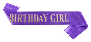 Close-up of purple satin birthday girl sash featuring gold foil lettering detail