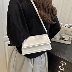 Chic white faux leather crossbody bag for women with double flap design and top stitching